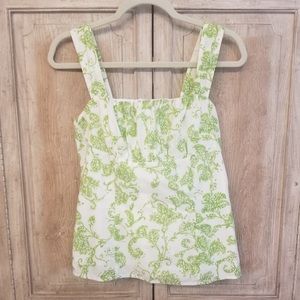 Harold’s green and white sleeveless top